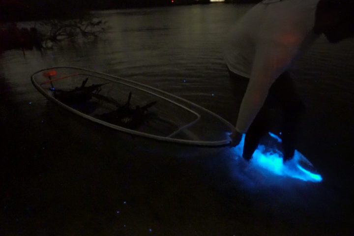 a person that is standing in the dark